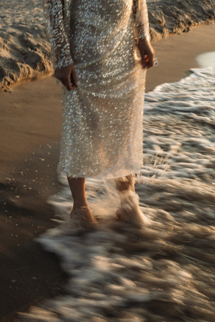 human design in business - women sparkly dress in ocean